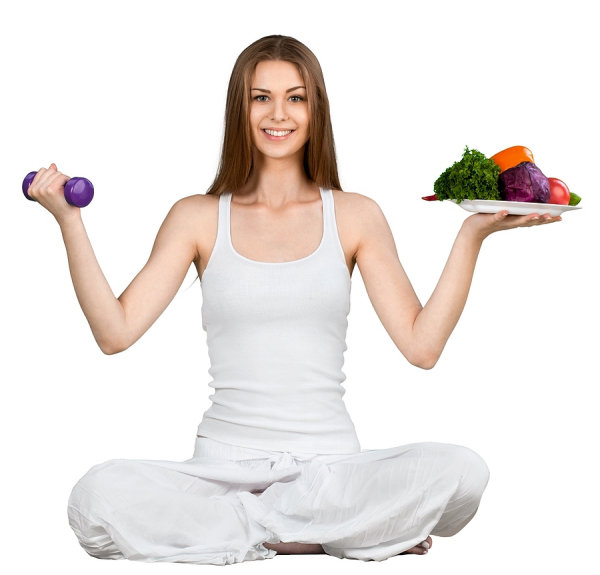 girl holding weights and food